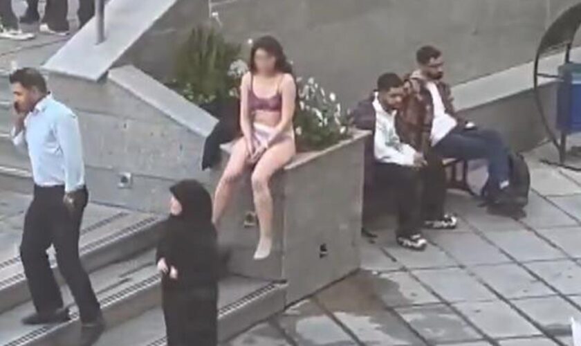 Woman 'violently arrested' after stripping to protest strict Islamic dress code - reports