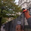 Workers put up security fencing near the White House on Monday. Pic: Reuters