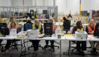 Fulton County officials count votes near Atlanta. Pic: Reuters