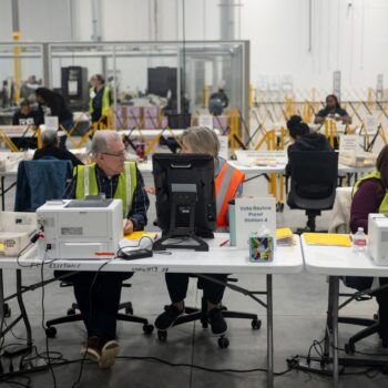 Fulton County officials count votes near Atlanta. Pic: Reuters