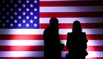 Voters watch results during an election night watch party for Sam Brown, Republican candidate for the U.S. Senate, Tuesday, Nov. 5, 2024, in Las Vegas, Nev. (AP Photo/Ian Maule)