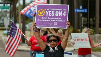 Beth Weinstein rallies in supporter of Yes on Amendment 4 regarding abortion in Florida outside of the polling place at the courthouse on Tuesday, Nov. 5, 2024, in Clearwater, Fla. (AP Photo/Mike Carlson)