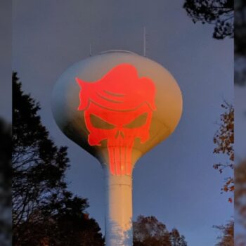 MAGA supporter sparks outrage after projecting Punisher logo with Trump’s hair on water tower