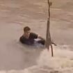 Man finds out the hard way what happens when you try to swim in floodwaters