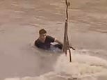 Man finds out the hard way what happens when you try to swim in floodwaters