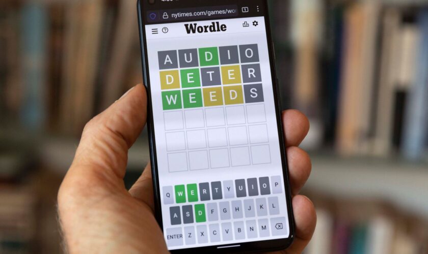 FILE - A Wordle game is seen on a mobile phone, July 15, 2022, in Boston. The New York Times is fighting off Wordle ...clones... ... arguing that numerous games inspired by the mega-popular word-guessing game infringe on its copyright protections. (AP Photo/Michael Dwyer, File)