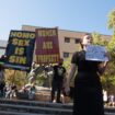 Texas campus in uproar after protesters hold signs declaring ‘women are property’ on quad after Trump victory