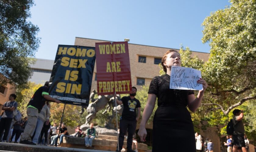 Texas campus in uproar after protesters hold signs declaring ‘women are property’ on quad after Trump victory