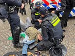 Chaos in Amsterdam as pro-Palestine protesters clash with Dutch police after officers move in on 'illegal' demonstration in aftermath of attacks on Israeli football fans