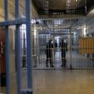 Des gardiens de prison se tiennent dans le couloir de la prison des Baumettes à Marseille le 6 novembre 2017.