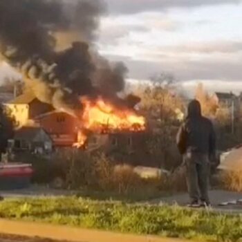 A building on fire near Moscow after a drone attack. Pic: Reuters