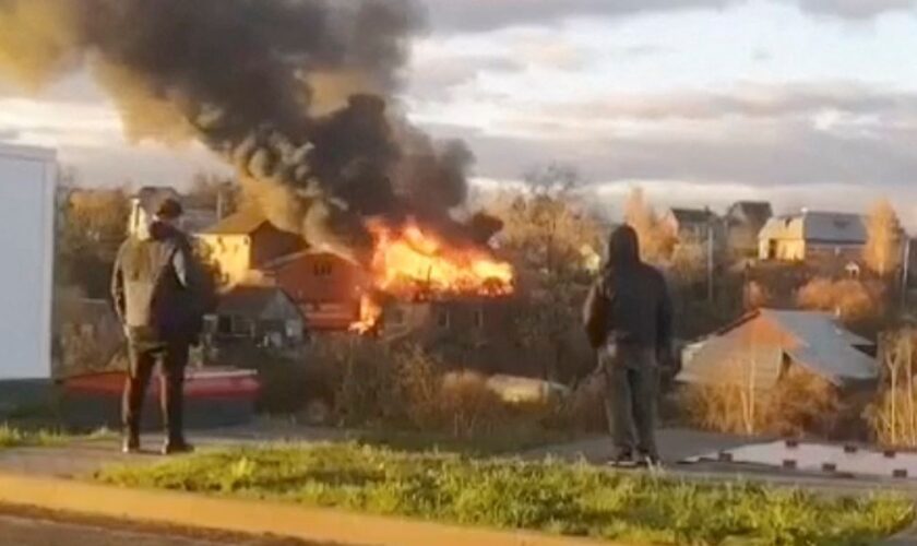 A building on fire near Moscow after a drone attack. Pic: Reuters