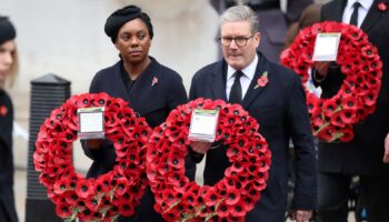 Conservative Party leader Kemi Badenoch and Britain's Prime Minister Keir Starmer carry wreaths during the National Service of Remembrance at The Cenotaph in London, Britain, November 10, 2024. Chris Jackson/Pool via REUTERS