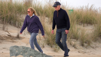 Biden appears to struggle while walking on beach with first lady