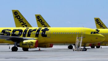 FILE - A line of Spirit Airlines jets sit on the tarmac at Orlando International Airport on May 20, 2020, in Orlando, Fla. (AP Photo/Chris O'Meara, File)