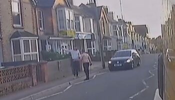 Horror moment driver smashes into pedestrian and hurls him 20ft over garden wall