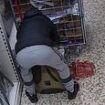 Moment brazen Tesco shoplifting gang cram groceries into rucksacks in front of shoppers - as thieves who stole £200,000 of goods from 100 stores are jailed