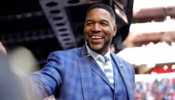 Michael Strahan defended by co-host after failing to put his hand over his heart during national anthem