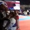 Shocking moment coach father slaps his eight-year-old Taekwondo star daughter across the face at European Championships after she lost in the final