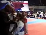 Shocking moment coach father slaps his eight-year-old Taekwondo star daughter across the face at European Championships after she lost in the final