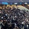 Moment violence breaks out during France's football match against Israel as fans seen brawling and others flee their seats after more than 6,000 police were deployed to 'high risk' game