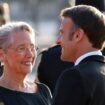 France's President Emmanuel Macron (R) and France's Prime Minister Elisabeth Borne chat as they wait for the arrival of the Indian Prime Minister ahead of a dinner at The Louvre Museum in Paris, on July 14, 2023. (Photo by Ludovic MARIN / AFP)