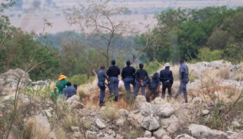 Body pulled from mine after police cut off supplies to illegal miners pinned underground