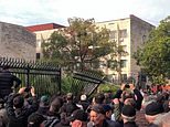 Moment enraged crowd ram truck through fence and storm parliament building to scupper major deal with Putin in Russian-backed breakaway Georgian region