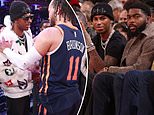 Marcus Rashford dons glitzy grillz as Man United star makes the most of his England exile by sitting courtside in New York... and he is joined by former team-mate who he visited before his 12-hour Belfast tequila bender