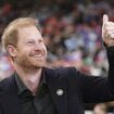 The pundit prince! Harry waves to fans as he makes surprise pitchside appearance at Canadian cup final