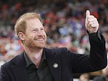 The pundit prince! Harry waves to fans as he makes surprise pitchside appearance at Canadian cup final