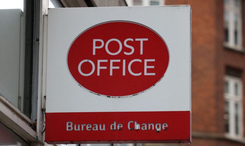 Signage at a Post Office branch in Westminster, London, Britain, March 12, 2024. REUTERS/Hollie Adams