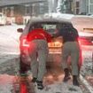 Snow chaos hits Britain: Commuters brace for disruption with cars stuck, trains axed and temperatures plummeting to -7.8C as UK gets 'first taste of winter' - with more warnings in place today