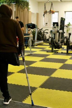 A man without his leg looks inside of Tytanova Rehab, Kyiv