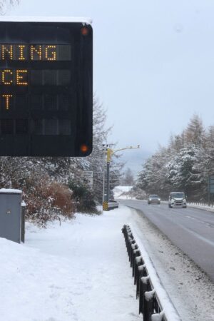 A sign displays a warning at the side of the A9 near Aviemore, Scotland, Britain November 21, 2024 REUTERS/Russell Cheyne