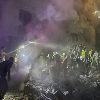 Rescue workers at the site. Pic: AP