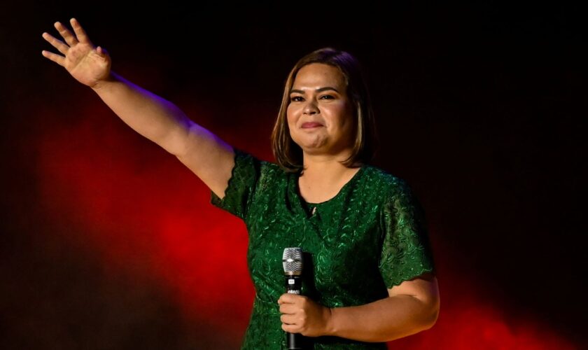 Vice-presidential candidate Sara Duterte-Carpio, daughter of Philippine President Rodrigo Duterte, waves to her supporters during the first day of campaign period for the 2022 presidential election, at the Philippine Arena, in Bocaue, Bulacan province, Philippines, February 8, 2022. REUTERS/Lisa Marie David