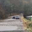 Storm Bert horror as baby is trapped inside car sinking in floodwater in front of mum