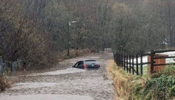 Storm Bert horror as baby is trapped inside car sinking in floodwater in front of mum