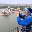 Barmy Army trumpeter scales iconic Sydney Harbour Bridge and belts out tunes in bid to wind up the Aussies a year before the Ashes