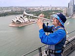 Barmy Army trumpeter scales iconic Sydney Harbour Bridge and belts out tunes in bid to wind up the Aussies a year before the Ashes