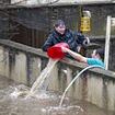 Storm Bert batters Britain: Hundreds of flights are cancelled as strong winds sweep across the country and downpours cause 'unprecedented' flooding - with the wild weather already claiming four lives