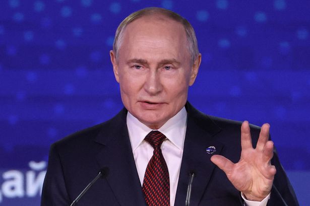 Vladimir Putin warned UK won't back down in new 'arms race' amid cyber attack fears