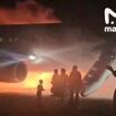 Terrifying moment families with young children flee down emergency slides as holiday jet bursts into flames after landing at Turkey's Antalya airport