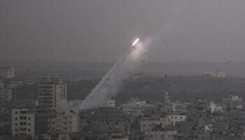 Smoke trails are seen as a rocket is launched from the northern Gaza Strip towards Israel November 17, 2012. Palestinian militants fired a rocket at Tel Aviv on Saturday but it was intercepted in mid-air by a newly deployed Israeli anti-missile battery and caused no casualties or damage, police said. REUTERS/Majdi Fathi (GAZA - Tags: CIVIL UNREST MILITARY POLITICS)