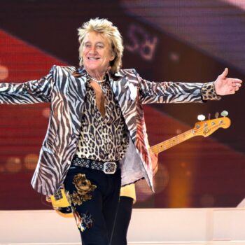 Rod Stewart gestures onstage at the Royal Arena during his "One Last Time" concert in Copenhagen, on Sunday, June 9, 2024. (Torben Christensen/Ritzau Scanpix via AP)