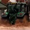 Tractor driver, 57, is arrested after driving through flooded high street during Storm Bert