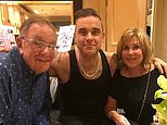 Robbie Williams reveals his mother has dementia four years after his father was diagnosed with Parkinson's