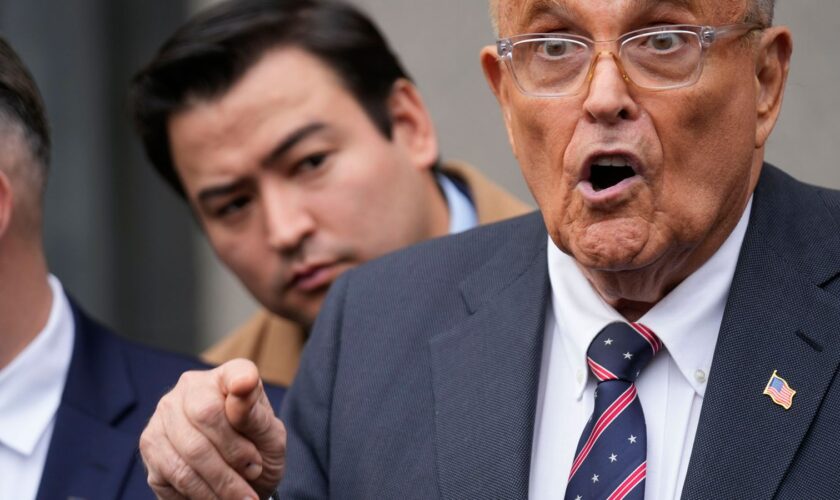 Rudy Giuliani speaks to reporters as he leaves the federal courthouse in New York, Tuesday, Nov. 26, 2024. (AP Photo/Seth Wenig)