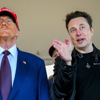 Elon Musk speaks with U.S. President-elect Donald Trump as they watch the launch of the sixth test flight of the SpaceX Starship rocket in Brownsville, Texas, U.S., November 19, 2024. Brandon Bell/Pool via REUTERS